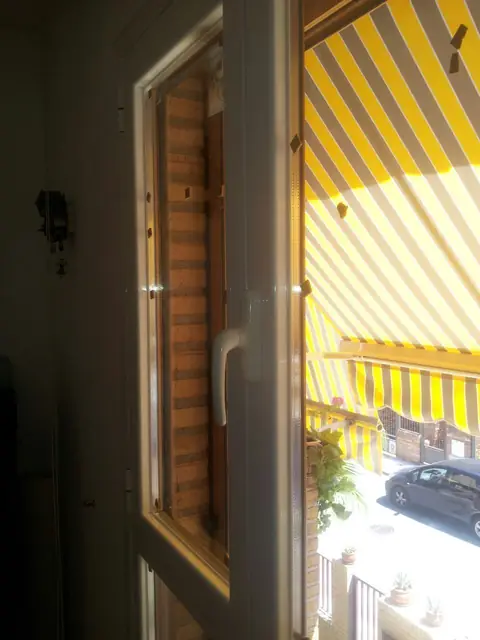 Sustitución de ventanas de madera por aluminio